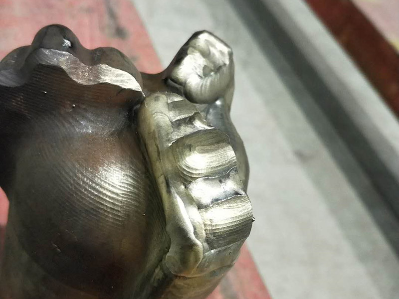Tungsten Carbide Cladding for PDC Drill Bits