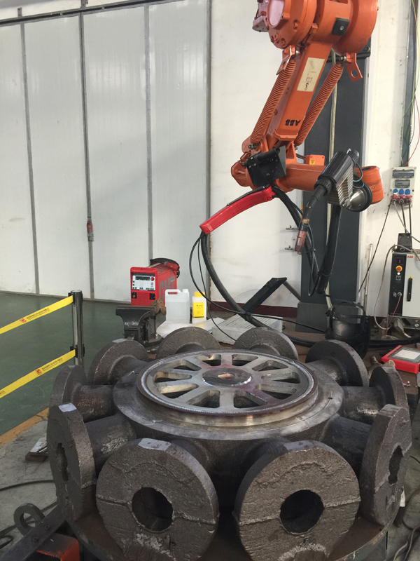 MIG overlay welding process applying wear-resistant layer on industrial component