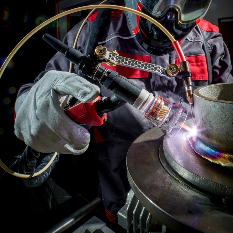Welder using TIG DynamicWire technology with ergonomic torch and automatic wire feeding